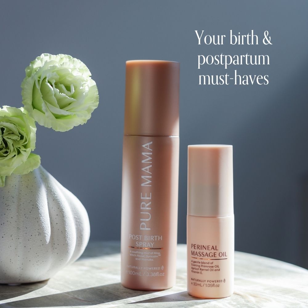 Two skincare bottles labeled Pure Mama NZ Post Birth Relief Spray and Perineal Massage Oil sit on a table next to a vase of green flowers. Text: Gentle essentials for your birth and postpartum vaginal recovery and care.