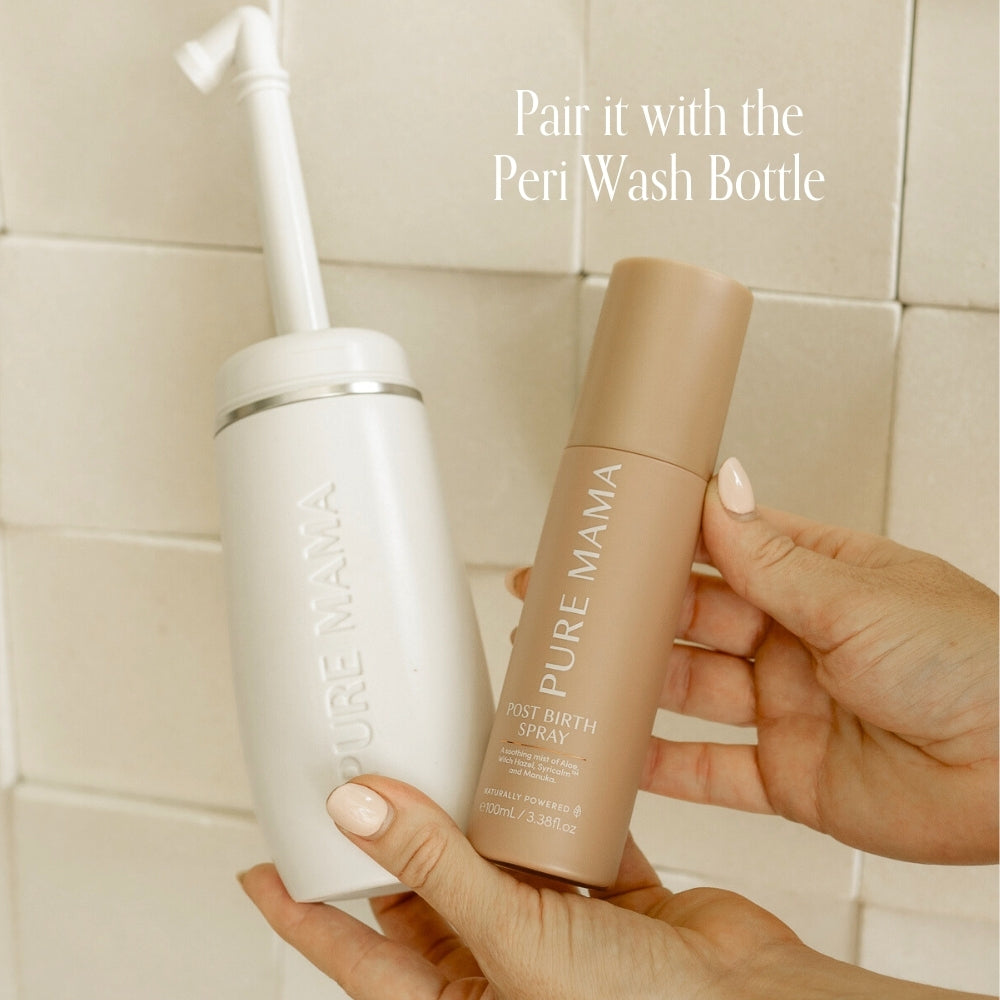 A hand holds a white Peri Wash Bottle and another holds a tan Pure Mama NZ Post Birth Relief Spray against a tiled background. Text: Pair with the Peri Wash Bottle for gentle postnatal healing.