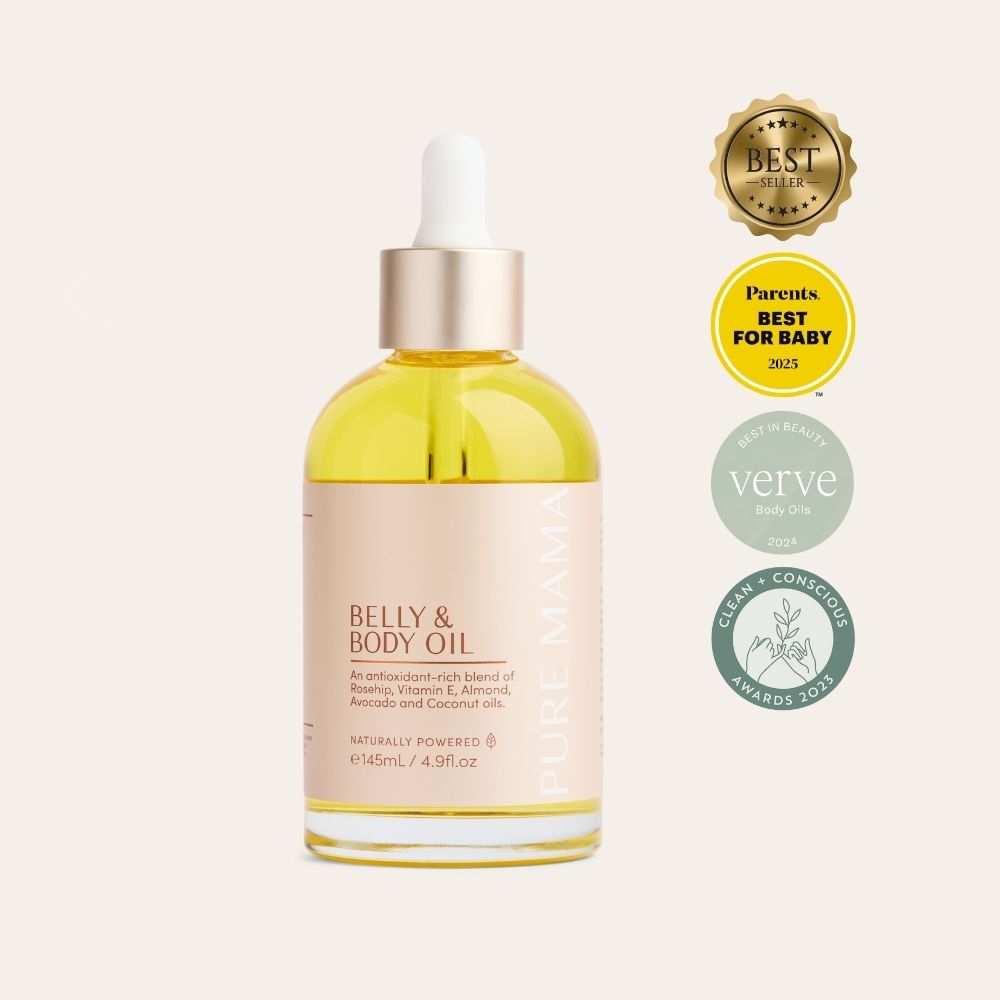 A clear Pure Mama NZ Belly & Body Oil bottle with dropper cap, filled with yellow oil. Three award badges highlight best seller, parents’ best for baby, and clean-conscious awards—designed to support skin elasticity and reduce stretch marks.