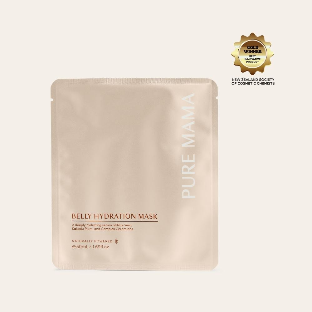 A beige Pure Mama NZ Belly Hydration Mask packet with white text is shown. The award-winning mask contains a hydrating serum, and a gold badge from the New Zealand Society of Cosmetic Chemists is in the upper right corner.