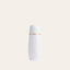 A white Pure Mama NZ Peri Wash Bottle with an ergonomic design and a gold band near the top, embossed with PURE MAMA, is placed against a plain light beige background.