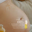 A close-up of a pregnant belly with oil applied in a swirl, beside a Belly Oil Mini dropper bottle by Pure Mama NZ. Text: Clinically proven—100% of women saw significant improvement in skin texture and stretch mark prevention.